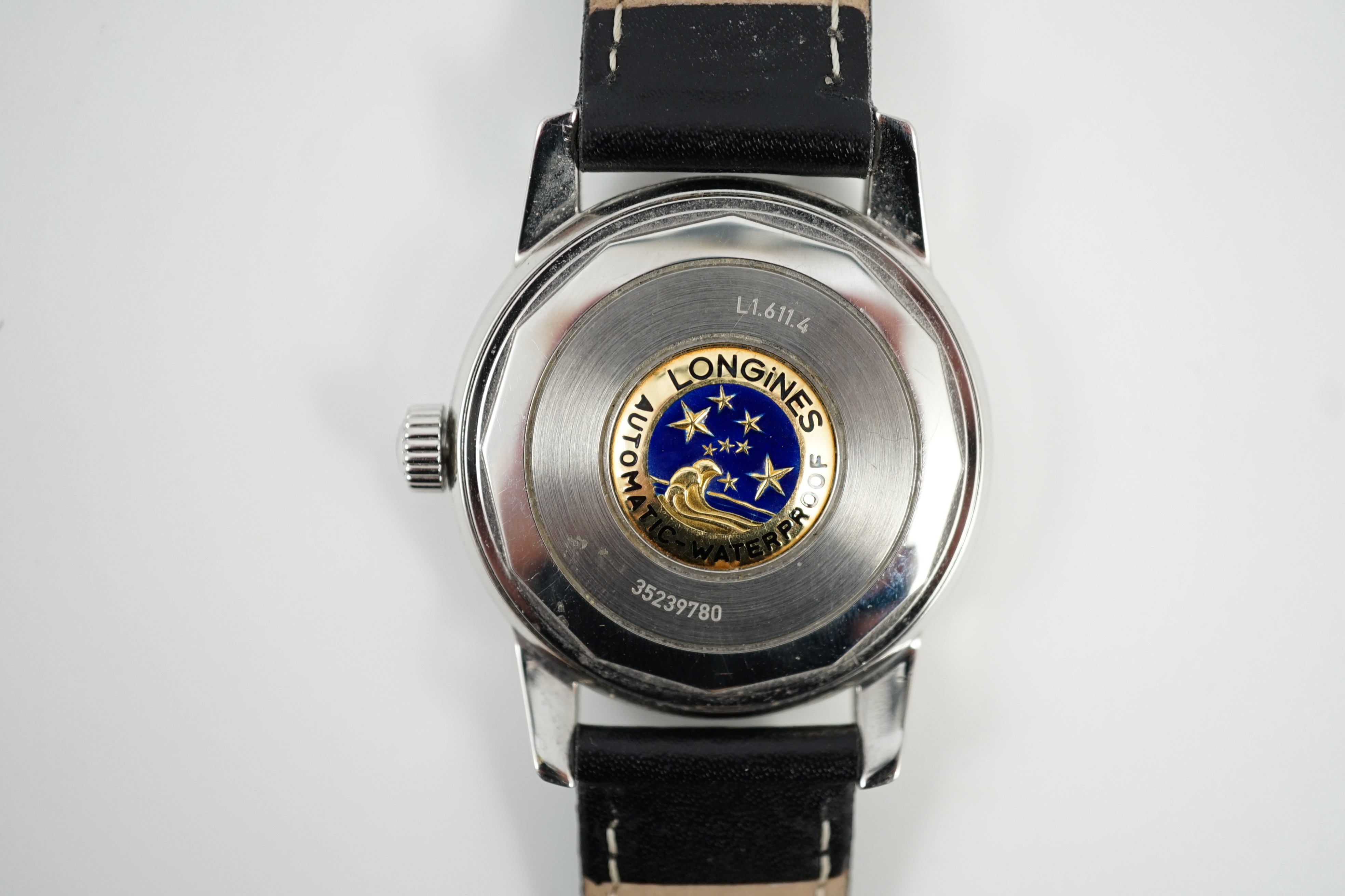 A gentleman's steel and enamel Longines Conquest Automatic wrist watch, with date aperture, case diameter 36mm, on a later associated leather strap.